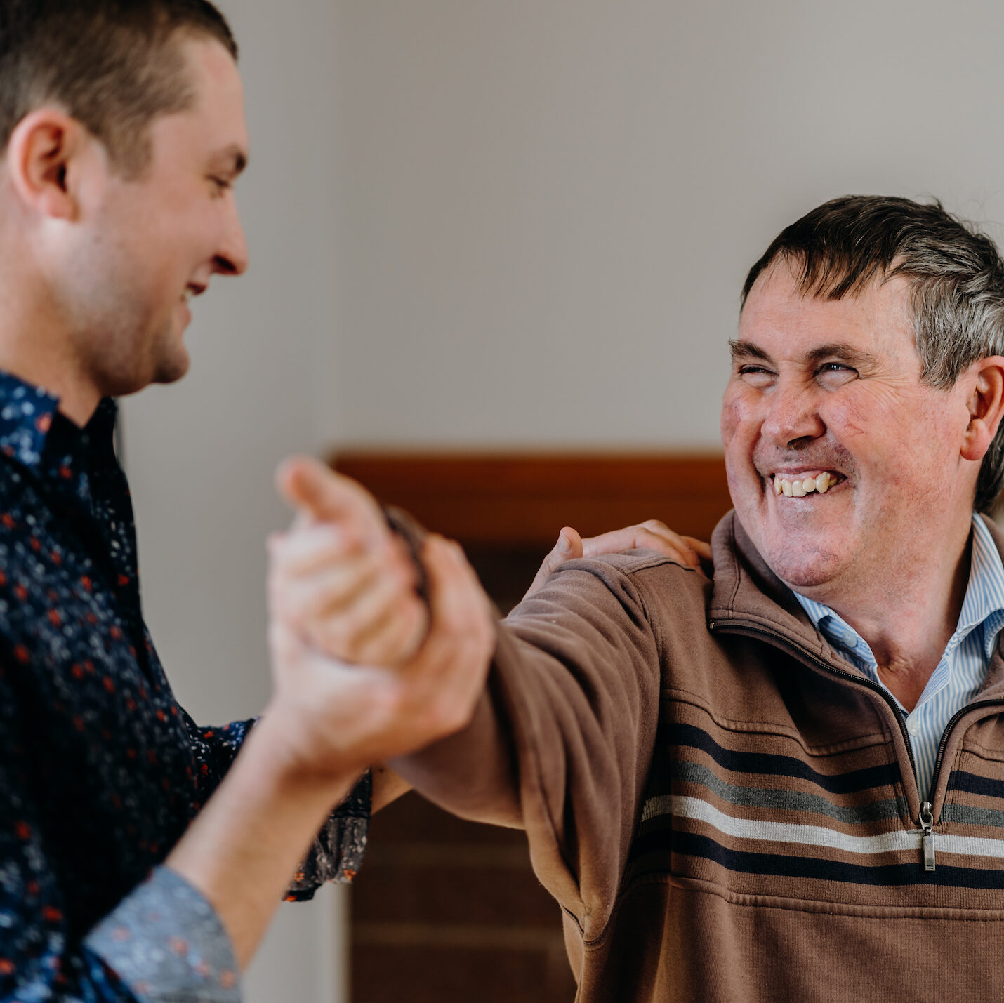 image of physiotherapist holding man's arm