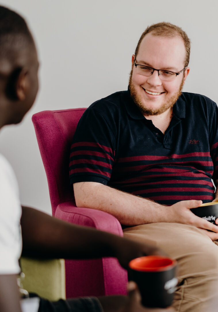 image of two men talking