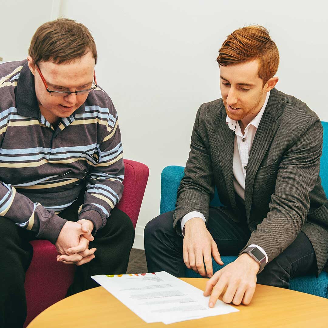 image of young man receiving advise and NDIS plan management service